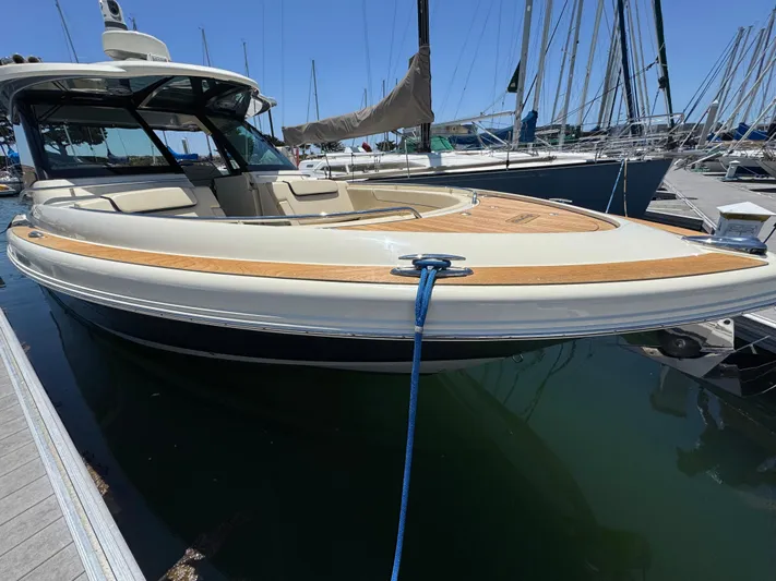 Sea Dragon Yacht Photos Pics 2023 Chris-Craft Calypso 35 boat docked at marina, showcasing sleek design and luxury features.