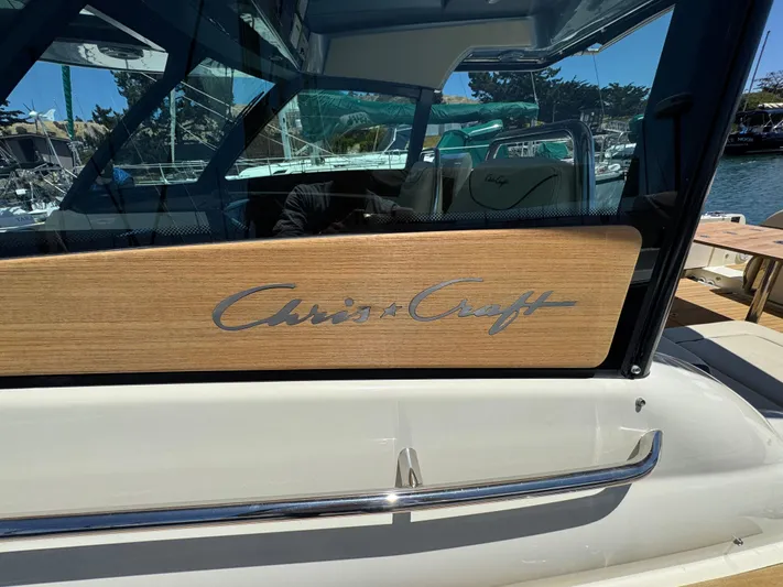 Sea Dragon Yacht Photos Pics 2023 Chris-Craft Calypso 35 boat with wooden panel and logo detail.