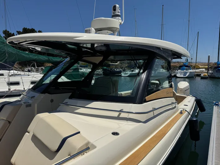 Sea Dragon Yacht Photos Pics 2023 Chris-Craft Calypso 35 boat docked in a marina, showcasing sleek design.