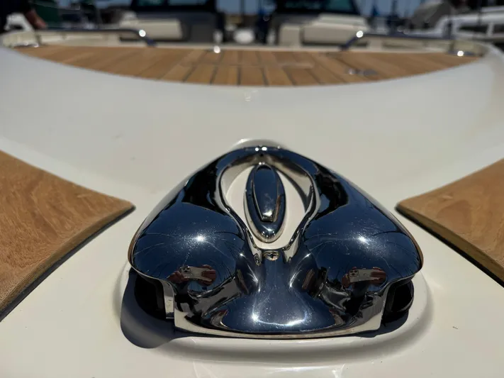 Sea Dragon Yacht Photos Pics 2023 Chris-Craft Calypso 35 boat with polished chrome detail and wooden deck.