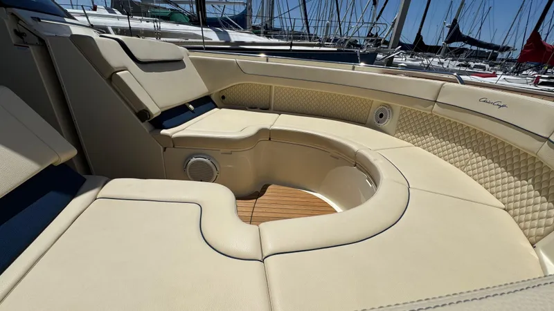 Sea Dragon Yacht Photos Pics Luxurious seating on 2023 Chris-Craft Calypso 35 boat, featuring elegant beige upholstery.