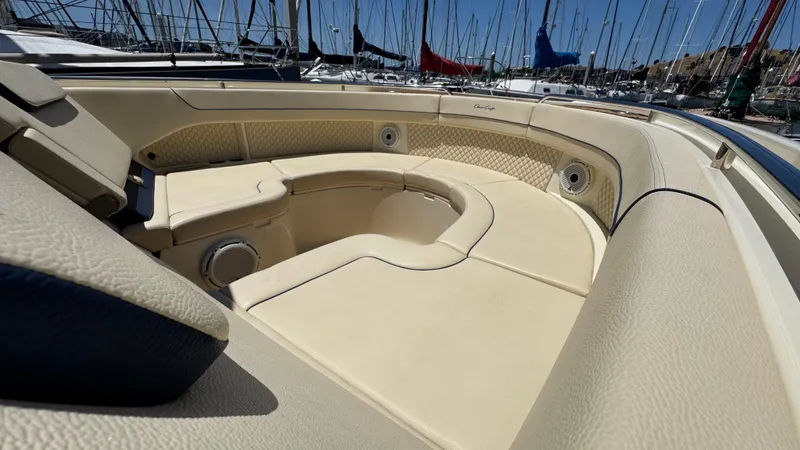 Sea Dragon Yacht Photos Pics Luxurious seating area on 2023 Chris-Craft Calypso 35 boat, docked in marina.