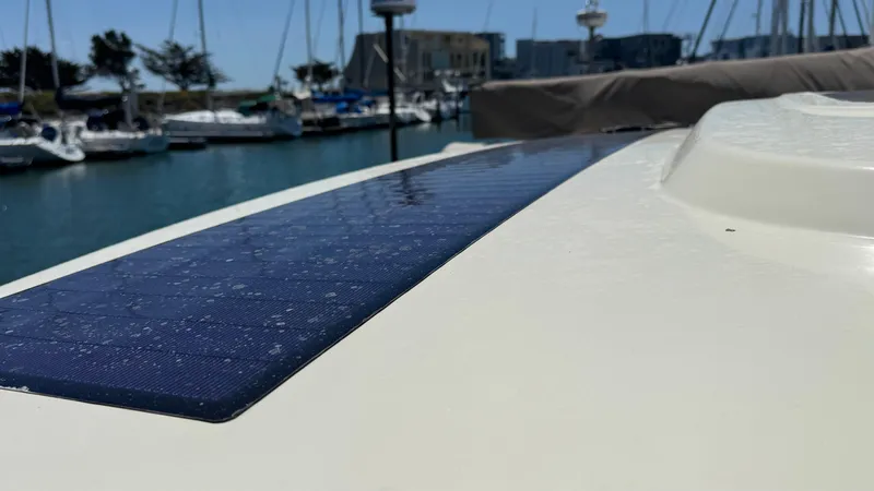 Sea Dragon Yacht Photos Pics 2023 Chris-Craft Calypso 35 with solar panel, docked in marina.