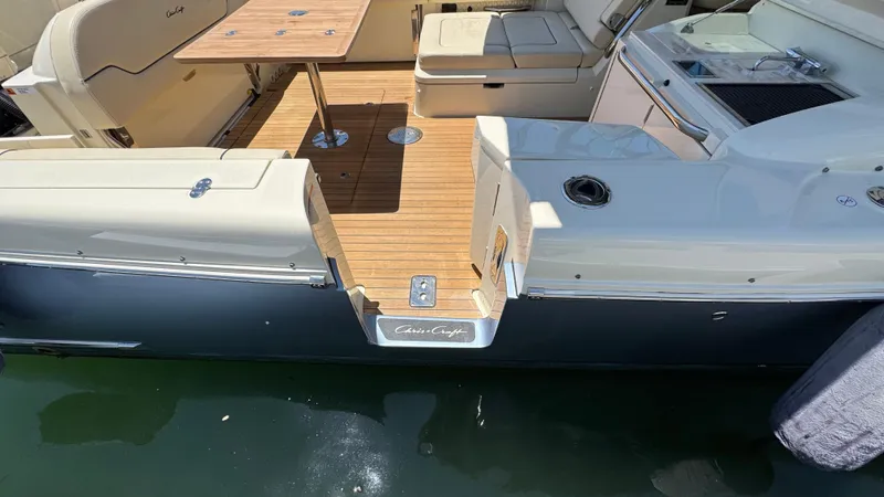 Sea Dragon Yacht Photos Pics 2023 Chris-Craft Calypso 35 boat with teak deck and seating area.
