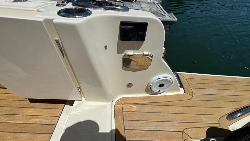 Sea Dragon Yacht Photos Pics 2023 Chris-Craft Calypso 35 boat deck with teak flooring and water access.