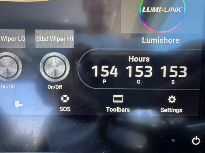 Sea Dragon Yacht Photos Pics 2023 Chris-Craft Calypso 35 dashboard display showing wiper controls and engine hours.