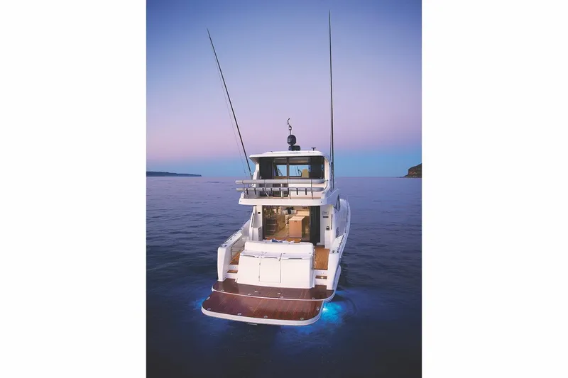 True North Yacht Photos Pics Manufacturer Provided Image: 2020 Maritimo M59 yacht at sunset on calm waters.