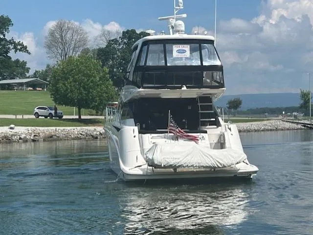 Yonder Star Yacht Photos Pics 2016 Sea Ray 510 Fly yacht for sale, cruising on a serene lake.