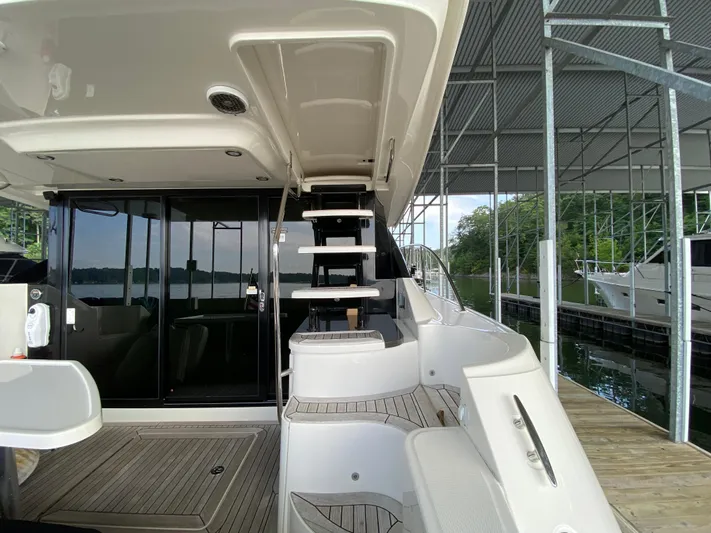 Yonder Star Yacht Photos Pics 2016 Sea Ray 510 Fly yacht interior with stairs and dock view.