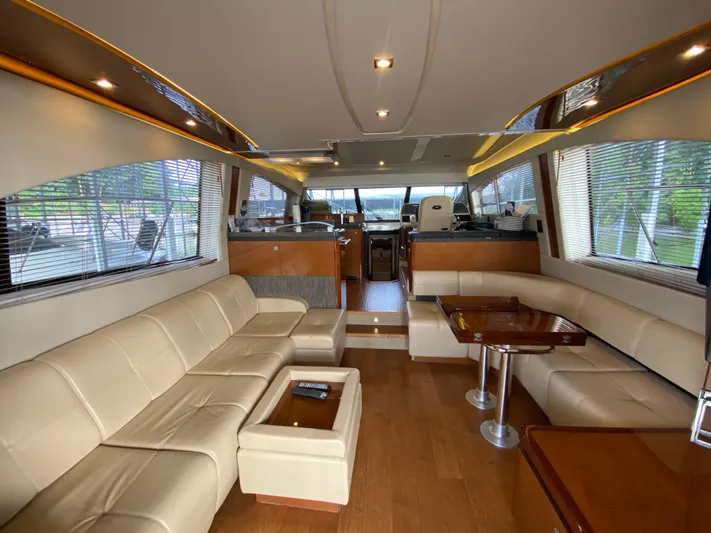 Yonder Star Yacht Photos Pics Luxurious interior of 2016 Sea Ray 510 Fly yacht with elegant seating and wooden accents.