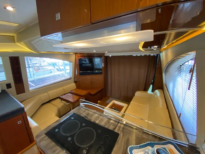 Yonder Star Yacht Photos Pics Luxurious interior of 2016 Sea Ray 510 Fly yacht with modern furnishings and entertainment system.