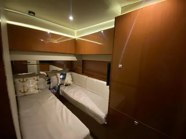 Yonder Star Yacht Photos Pics Luxurious interior cabin of 2016 Sea Ray 510 Fly yacht with elegant wood finish.