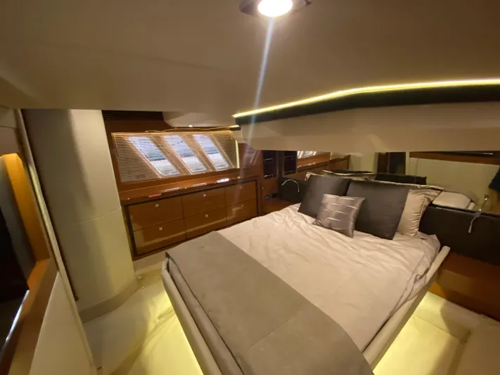 Yonder Star Yacht Photos Pics Luxurious bedroom interior of 2016 Sea Ray 510 Fly yacht with modern design and ambient lighting.