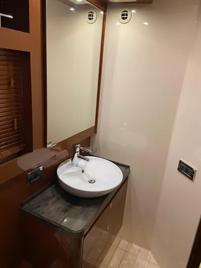 Yonder Star Yacht Photos Pics Luxurious bathroom interior of 2016 Sea Ray 510 Fly yacht with modern sink and mirror.