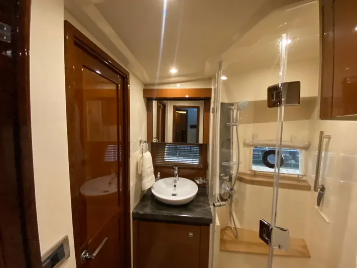 Yonder Star Yacht Photos Pics Luxurious bathroom interior of 2016 Sea Ray 510 Fly yacht with modern fixtures.