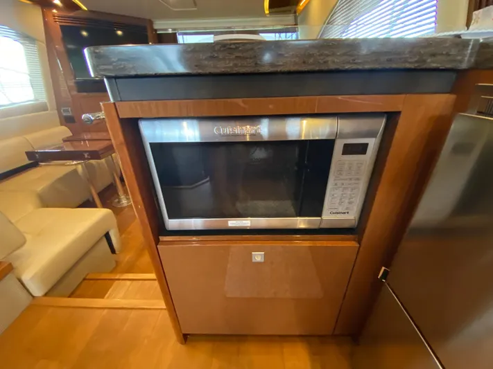 Yonder Star Yacht Photos Pics Luxurious interior of 2016 Sea Ray 510 Fly yacht featuring a built-in Cuisinart microwave.