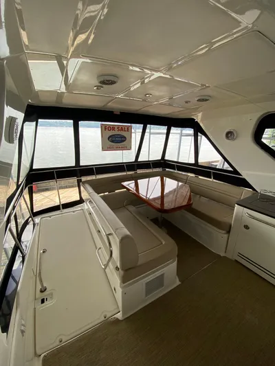 Yonder Star Yacht Photos Pics Interior of 2016 Sea Ray 510 Fly yacht with seating and table, for sale sign visible.