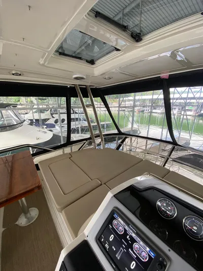 Yonder Star Yacht Photos Pics Interior view of 2016 Sea Ray 510 Fly yacht with helm and seating area.