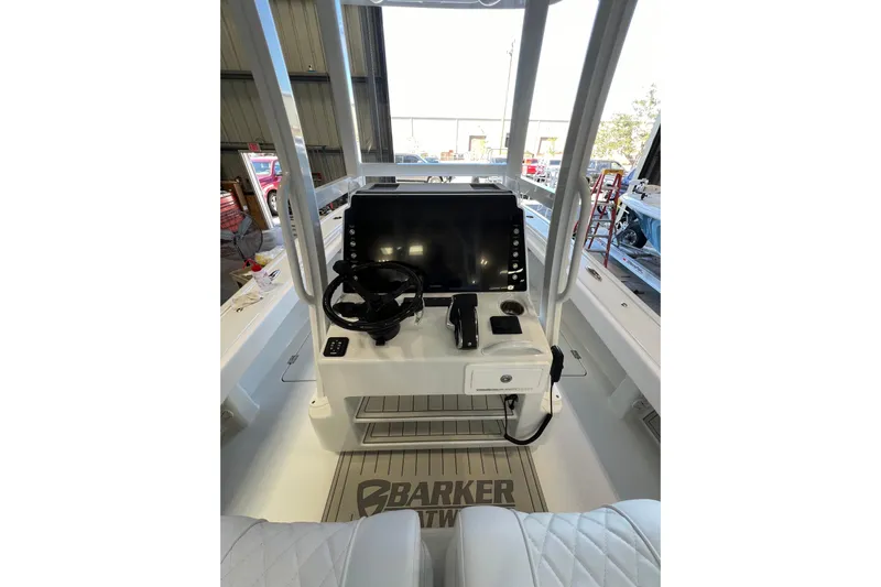  Yacht Photos Pics 2025 Barker Boatworks 26 Open console with steering wheel and navigation display.