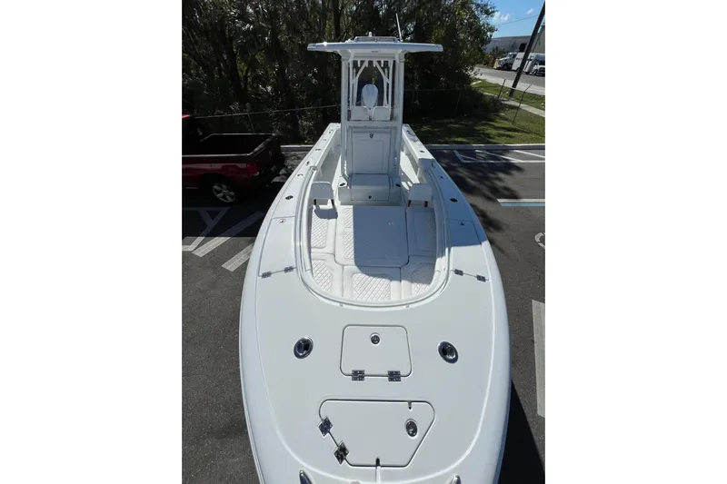  Yacht Photos Pics 2025 Barker Boatworks 26 Open, sleek design, spacious deck, parked outdoors.