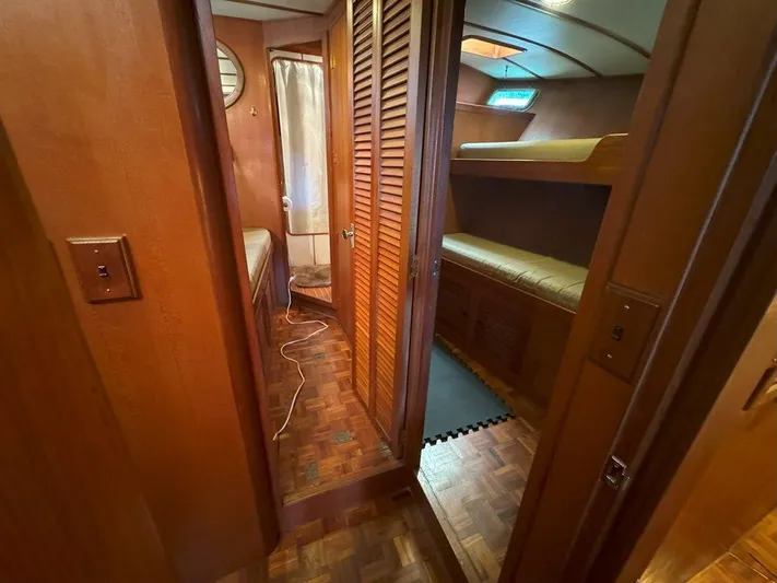  Yacht Photos Pics Interior of 1980 Ocean Alexander 50 MK1 yacht with wood paneling and bunk beds.