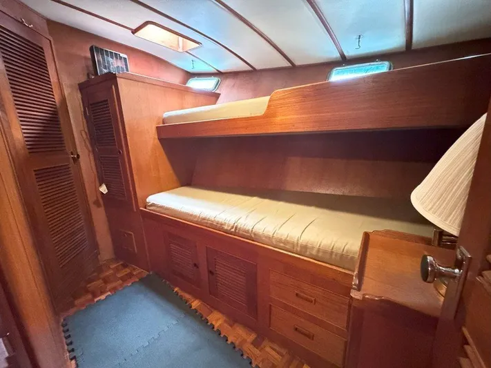  Yacht Photos Pics Interior cabin of 1980 Ocean Alexander 50 MK1 yacht with wooden bunk beds.
