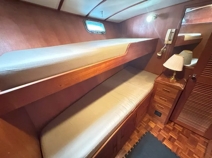  Yacht Photos Pics Interior of 1980 Ocean Alexander 50 MK1 yacht with wooden bunk beds and storage.