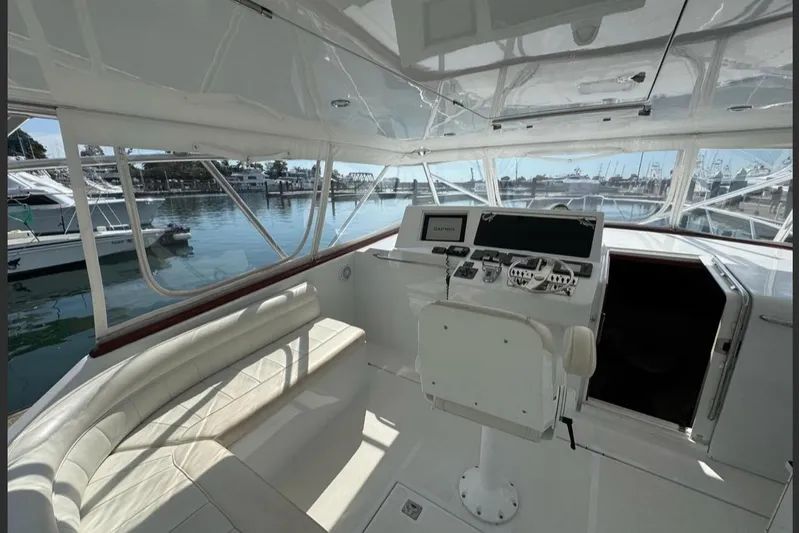  Yacht Photos Pics 2004 Cabo 40 Express Los Suenos yacht interior with helm and seating area.