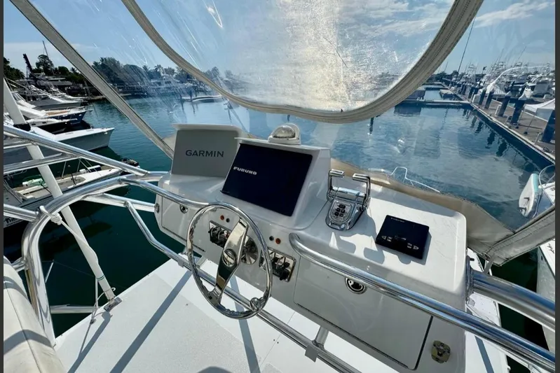  Yacht Photos Pics Helm of 2004 Cabo 40 Express Los Suenos with Garmin and Furuno navigation systems.