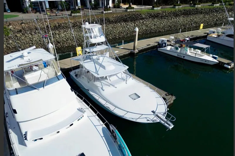  Yacht Photos Pics 2004 Cabo 40 Express Los Suenos yacht docked at marina, aerial view.