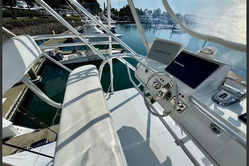  Yacht Photos Pics Helm of 2004 Cabo 40 Express Los Suenos with Garmin navigation, docked in marina.