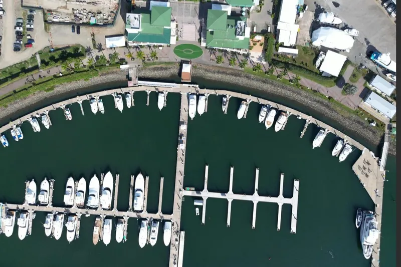  Yacht Photos Pics Aerial view of marina with boats, featuring Cabo 40 Express Los Suenos, 2004 model.