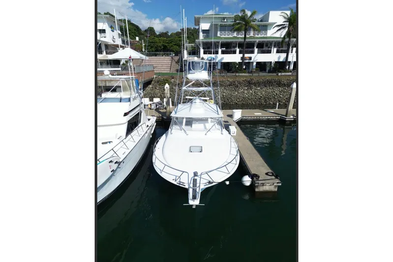  Yacht Photos Pics 2004 Cabo 40 Express Los Suenos yacht docked at marina, aerial view.