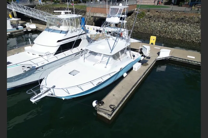  Yacht Photos Pics 2004 Cabo 40 Express Los Suenos yacht docked at marina, aerial view.