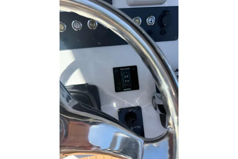  Yacht Photos Pics Steering wheel and controls of 2019 Cape Horn 27XS boat cockpit.