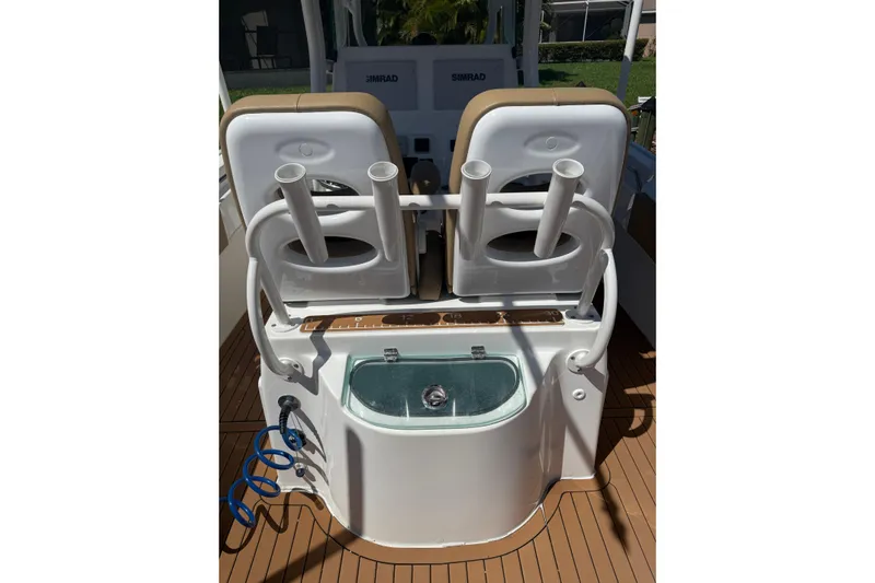  Yacht Photos Pics 2019 Cape Horn 27XS boat interior with rod holders and livewell on deck.