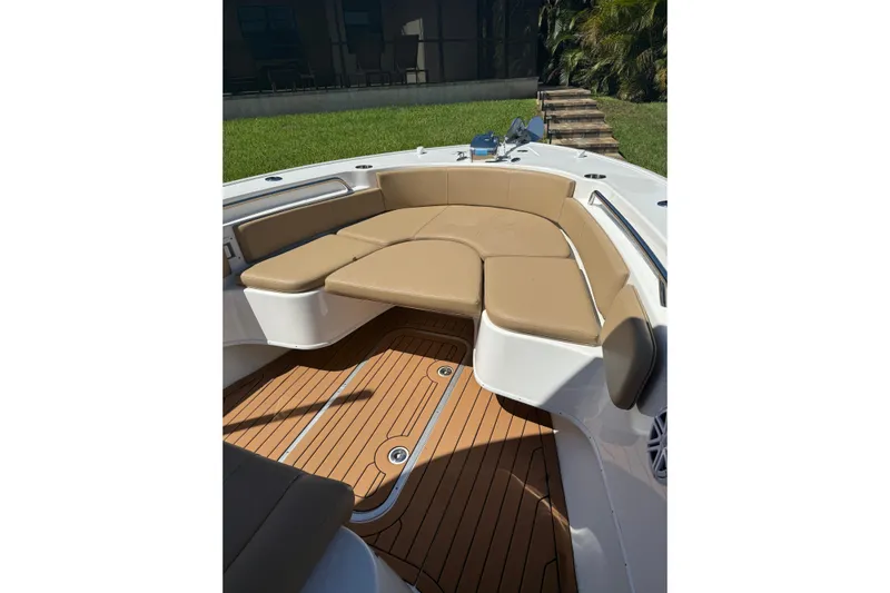  Yacht Photos Pics 2019 Cape Horn 27XS boat with tan cushioned seating and teak-style flooring.