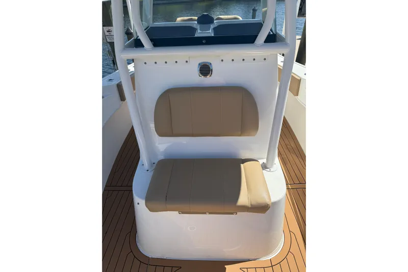  Yacht Photos Pics 2019 Cape Horn 27XS boat interior with tan seating and wood-style flooring.