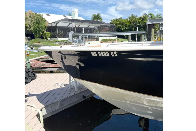  Yacht Photos Pics 2019 Cape Horn 27XS boat docked under a clear blue sky.