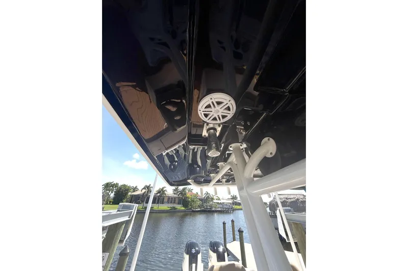  Yacht Photos Pics 2019 Cape Horn 27XS boat interior view with speaker, docked by waterfront homes.