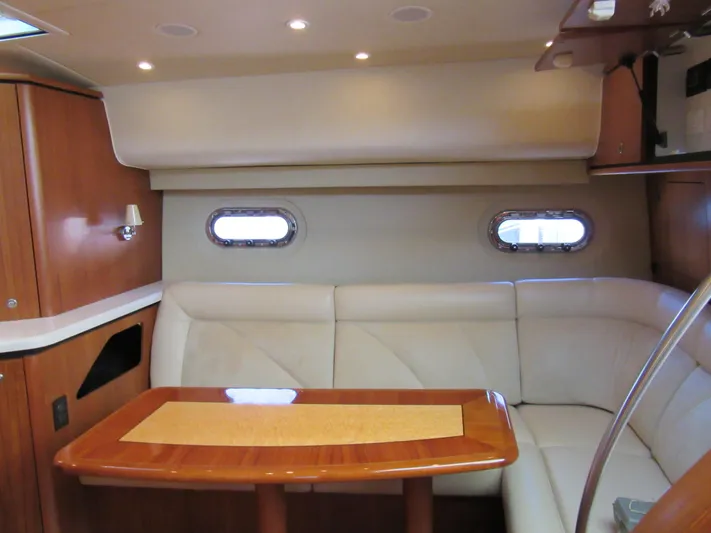 Baci Yacht Photos Pics 2006 Tiara Yachts 4300 Sovran interior with elegant seating and wooden table.