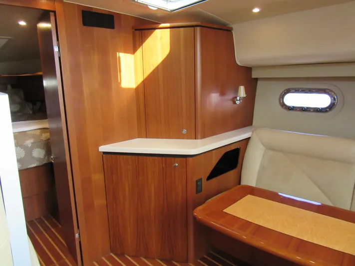 Baci Yacht Photos Pics 2006 Tiara Yachts 4300 Sovran interior with wood cabinetry and seating area.