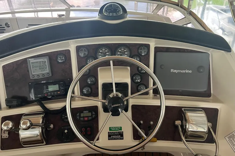  Yacht Photos Pics Helm of 2005 Carver 33 Super Sport with Raymarine navigation system and gauges.