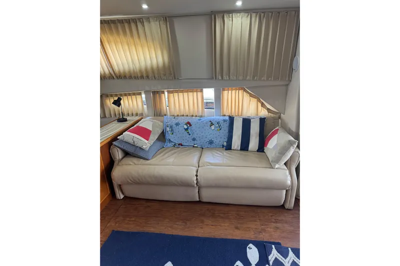  Yacht Photos Pics Interior of 2005 Carver 33 Super Sport with beige sofa and decorative pillows.
