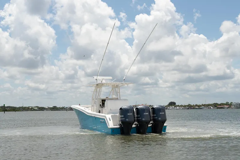  Yacht Photos Pics 2015 Invincible 36 Open Fisherman boat with triple Yamaha engines on water.