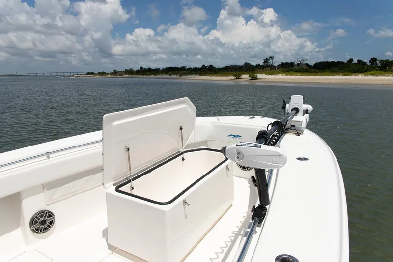  Yacht Photos Pics 2015 Invincible 36 Open Fisherman boat on calm waters with open storage compartment.