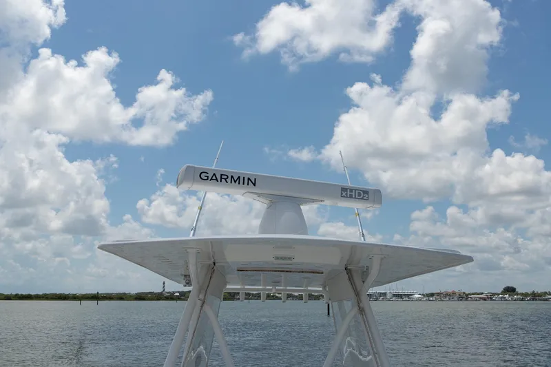  Yacht Photos Pics 2015 Invincible 36 Open Fisherman with Garmin radar against a cloudy sky.