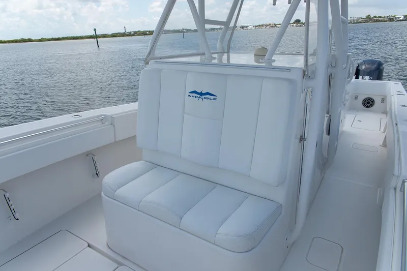  Yacht Photos Pics 2015 Invincible 36 Open Fisherman boat interior with white seating and ocean backdrop.