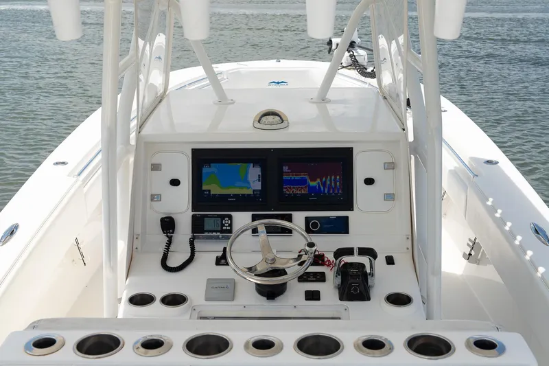  Yacht Photos Pics 2015 Invincible 36 Open Fisherman boat console with navigation screens and steering wheel.