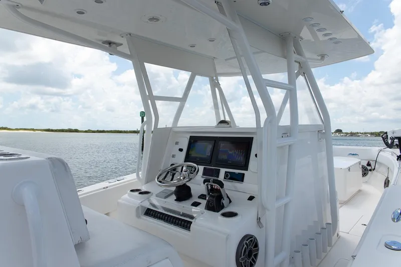  Yacht Photos Pics 2015 Invincible 36 Open Fisherman boat cockpit with modern navigation equipment.